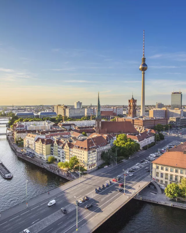 aerial; alexanderplatz; architecture; berlin; berlin mitte; berliner dom; blue; boats; bridge; buildings; capital; cathedral; church; city; cityscape; clouds; downtown; dusk; east berlin; europe; evening; fernsehturm; fischerinsel; german; germany; holidays; landmark; nikolaiviertel; panorama; panoramic; river; road; sky; skyline; skyscraper; spree; street; summer; sunny; sunset; television tower; tourism; tourist attraction; tower; town; traffic; travel; travel destination; trees; tv tower; twilight; urban