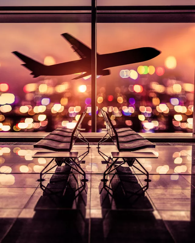 Airport Lounge and airplane take off in the city