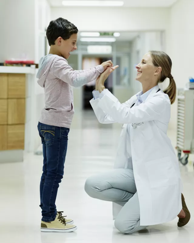 Doctor playing with young boy