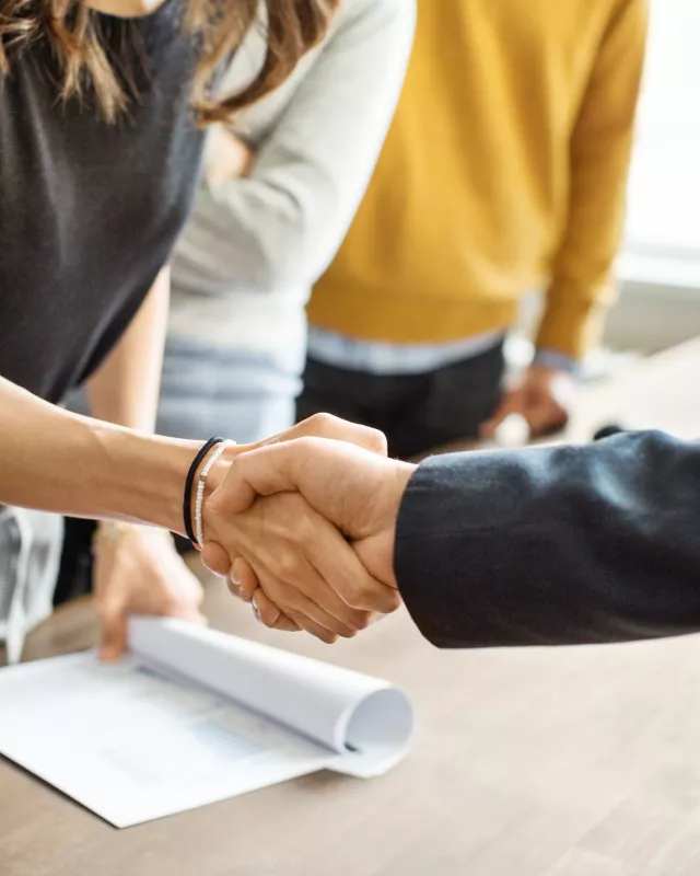 Business people shaking hands in office