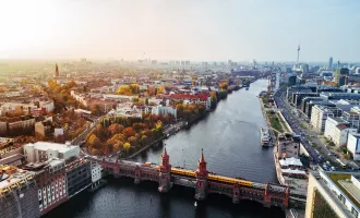 Aerial view of Berlin with view of Oberbaum bridge and yellow U-bahn on sunny autumn day