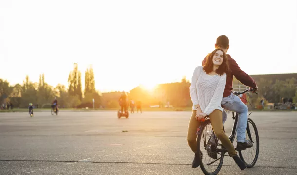 Two teenager on a bicycle