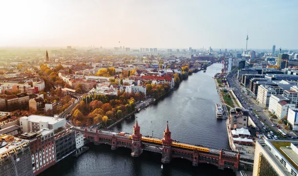 Aerial view of Berlin with view of Oberbaum bridge and yellow U-bahn on sunny autumn day