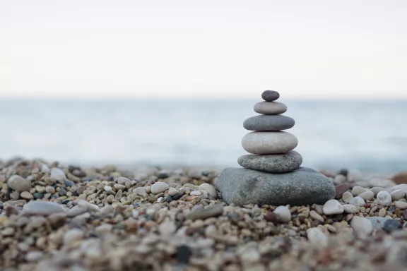 Balanced stones on a pebble beach Balanced stones on a pebble beach